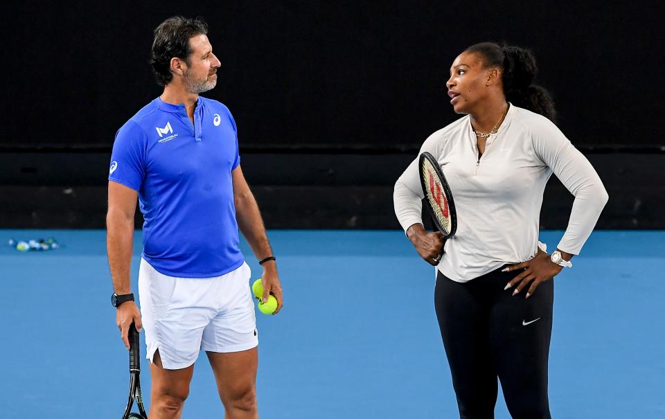 Serena Williams (pictured right) and coach Patrick Mouratoglou (pictured left) chat during a practice session.