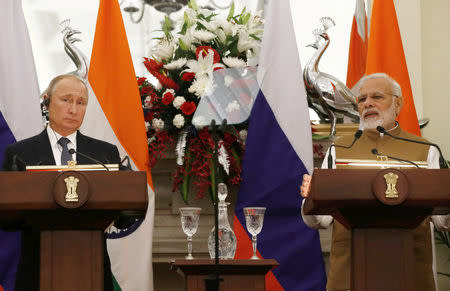 Russian President Vladimir Putin and India's Prime Minister Narendra Modi attend a presentation of a joint statement after their delegation level talks at Hyderabad House in New Delhi, October 5, 2018. REUTERS/Adnan Abidi