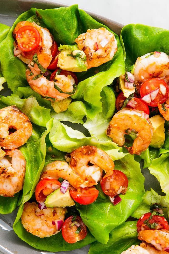 <p>Lettuce wraps are the one of the best ways to eat healthy (and low carb). These wraps are stuffed with our new favourite twist on prawn salad: basil avocado.</p><p>Get the <a href="https://www.delish.com/uk/cooking/recipes/a34959586/avocado-shrimp-salad-lettuce-wraps-recipe/" rel="nofollow noopener" target="_blank" data-ylk="slk:Basil Avocado Prawn Salad Wraps;elm:context_link;itc:0;sec:content-canvas" class="link ">Basil Avocado Prawn Salad Wraps</a> recipe.</p>