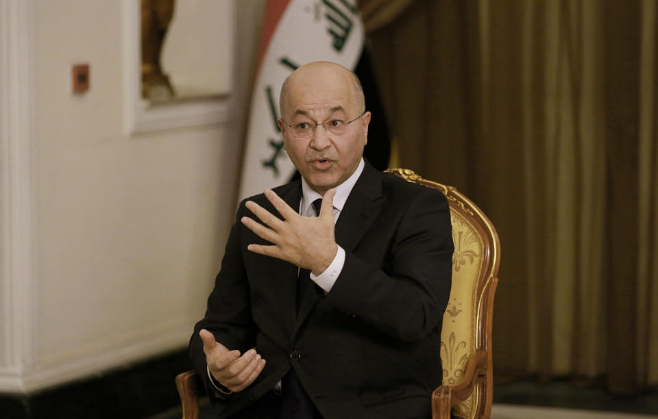 Iraq's President Barham Salih speaks during an interview with The Associated Press in Baghdad, Iraq, Friday, March 29, 2019. Salih says he does not see any "serious" opposition when it comes to the presence of American forces in Iraq as long as they are there for the specific mission of assisting in the fight against the Islamic State group. (AP Photo/Khalid Mohammed)