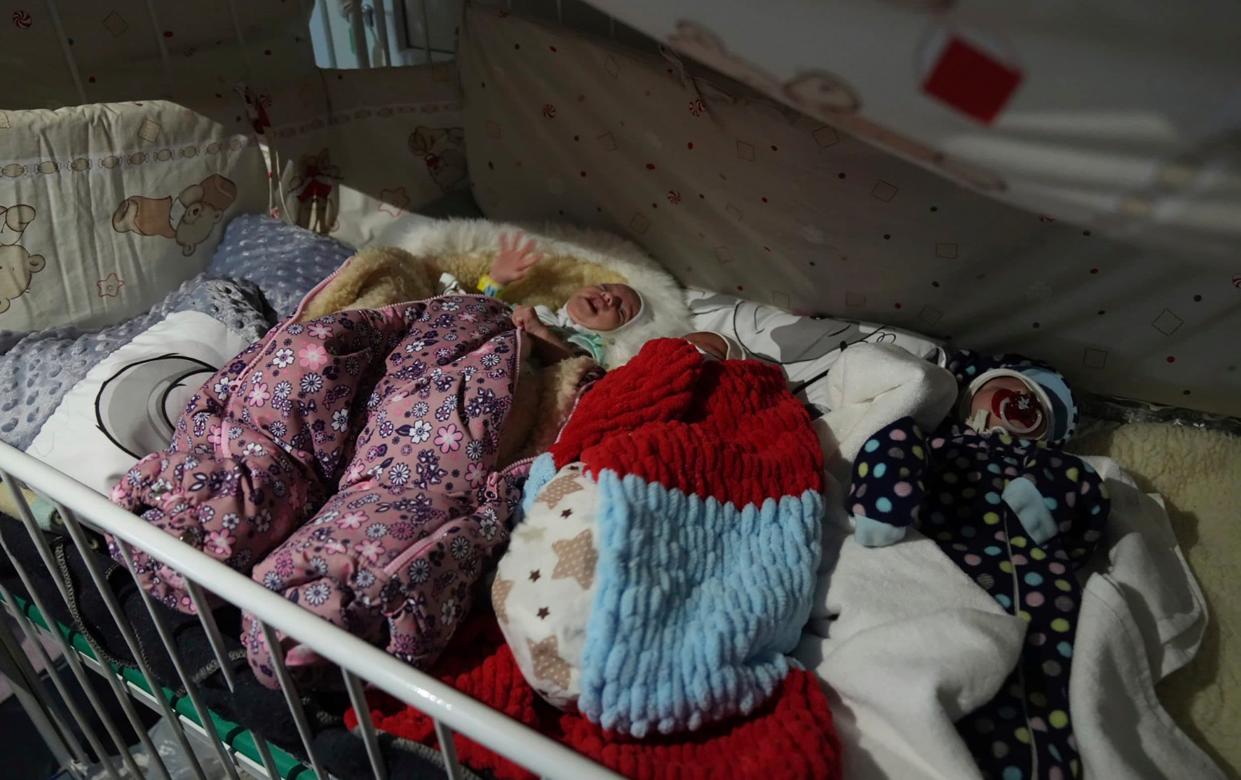Premature babies who were left behind by their parents lie in a bed in hospital number 3 - Evgeniy Maloletka/AP