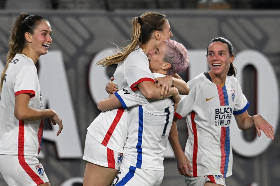 OL Reign's Megan Rapinoe hugs Veronica Latsko after her goal, which proved to be decisive. (Robyn Beck/AFP via Getty Images)