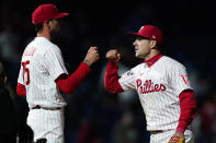 Philadelphia Phillies pitcher Connor Brogdon, left, and first baseman Rhys Hoskins celebrate after a baseball game against the Atlanta Braves, Friday, Sept. 23, 2022, in Philadelphia. (AP Photo/Matt Slocum)