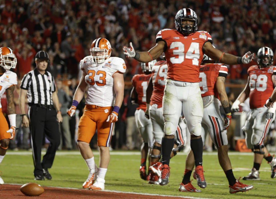 Ohio State running back Carlos Hyde (34) celebrates after running the ball to the 1-yard line during the second half of the Orange Bowl NCAA college football game against Clemson, Friday, Jan. 3, 2014, in Miami Gardens, Fla. Hyde scored a touchdown on the next play. (AP Photo/Lynne Sladky)