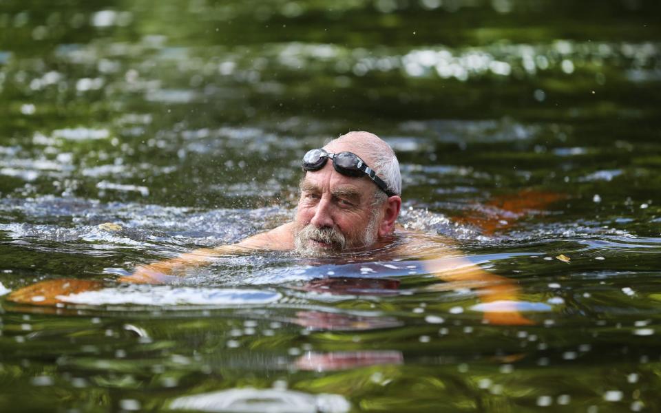 A swimmer enjoys bathing in the Ilkley Wharfe, which has been classified as 'poor' by the Environment Agency - Lorne Campbell 