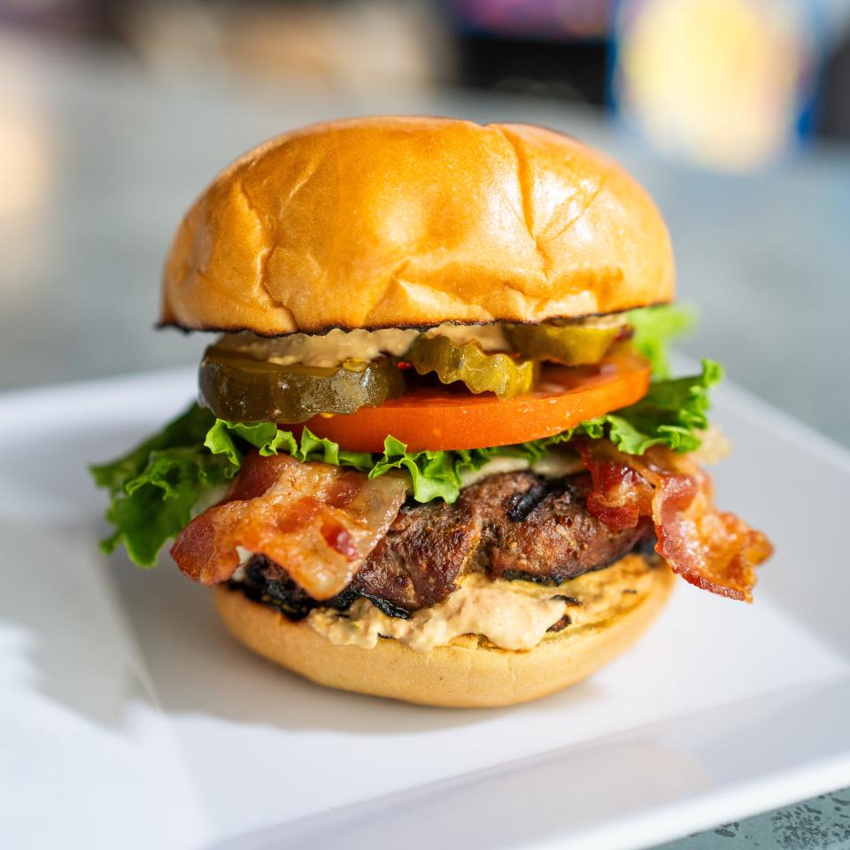 The O.G. Burger at First State Brewing Co. in Middletown: Star Ranch Angus beef, Cooper sharp cheese, bacon, Bibb lettuce, tomato, spicy pickles and andalouse sauce on a toasted brioche bun.