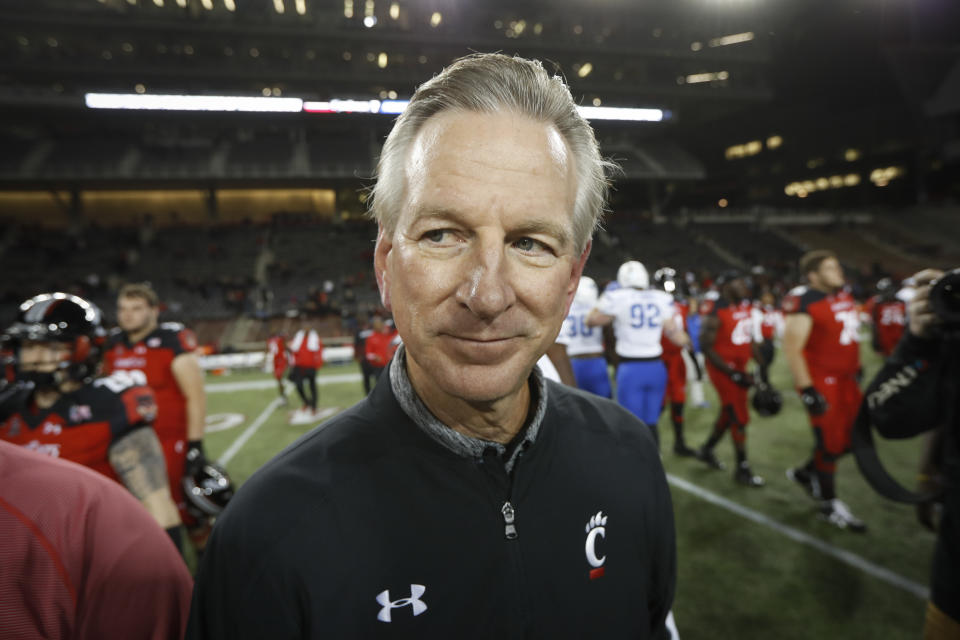 FILE - In this Nov. 18, 2016 file photo, Cincinnati coach Tommy Tuberville walks off the field after the team's NCAA college football game against Memphis in Cincinnati. Democratic Sen. Doug Jones of Alabama has called Republican challenger Tommy Tuberville “Coach Clueless” for the former football coach's recent comments about the coronavirus. Jones attacked Tuberville in a campaign appearance Friday, Sept. 11, 2020. (AP Photo/John Minchillo, File)