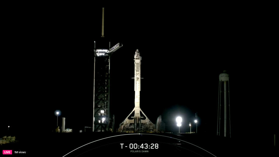 SpaceX's private Polaris Dawn Falcon 9 rocket on the launch pad at night before launch.