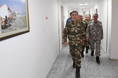 Turkey's Chief of the General Staff Hulusi Akar flanked by his top generals arrives for a meeting at the armed forces' headquarters in Ankara, Turkey January 20, 2018. Turkish Military/Handout via REUTERS