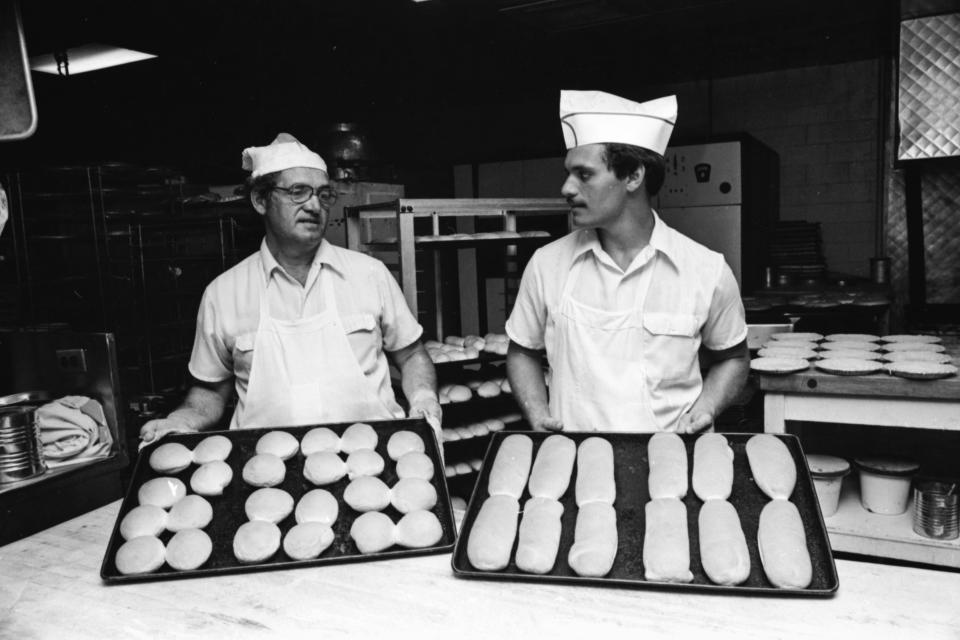 John Poulos, left, and his son, Stephen Poulos, at Superior Bakery on June 22, 1981. 