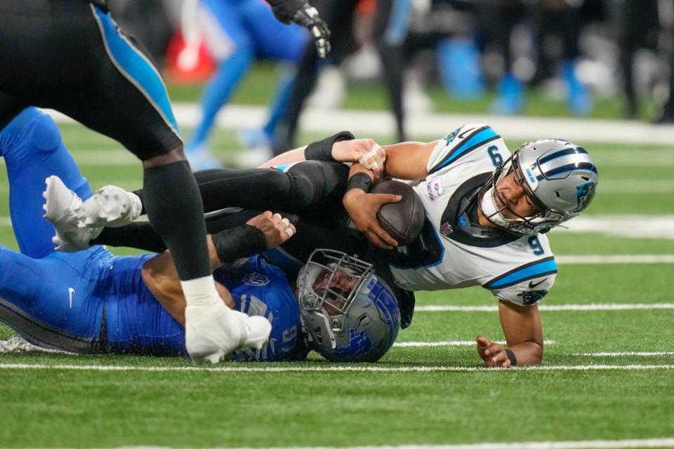Carolina Panthers quarterback Bryce Young (9) is sacked by Detroit Lions defensive end Aidan Hutchinson in the second half of an NFL football game in Detroit, Sunday, Oct. 8, 2023. (AP Photo/Carlos Osorio)