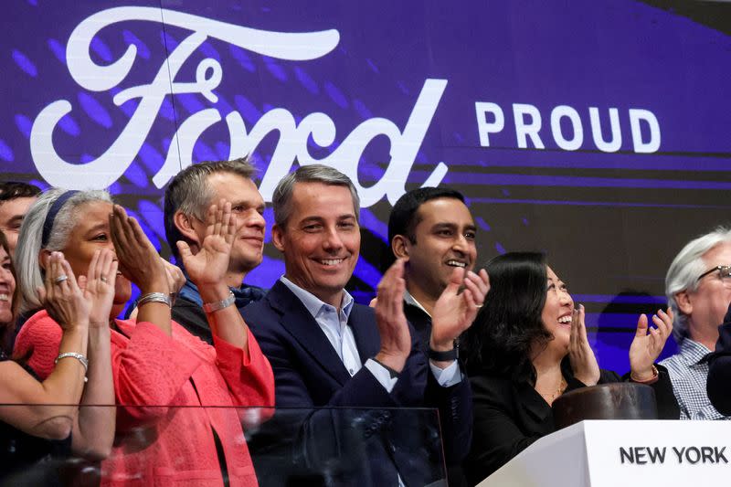 FILE PHOTO: Ford's CFO John Lawler and Linda Zhang, chief engineer for All Electric F-150 Lightning, ring the opening bell the floor of the NYSE in New York