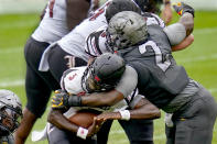 Pittsburgh defensive lineman David Green (2) sacks Louisville quarterback Malik Cunningham (3) during the first half of an NCAA college football game, Saturday, Sept. 26, 2020, in Pittsburgh. (AP Photo/Keith Srakocic)