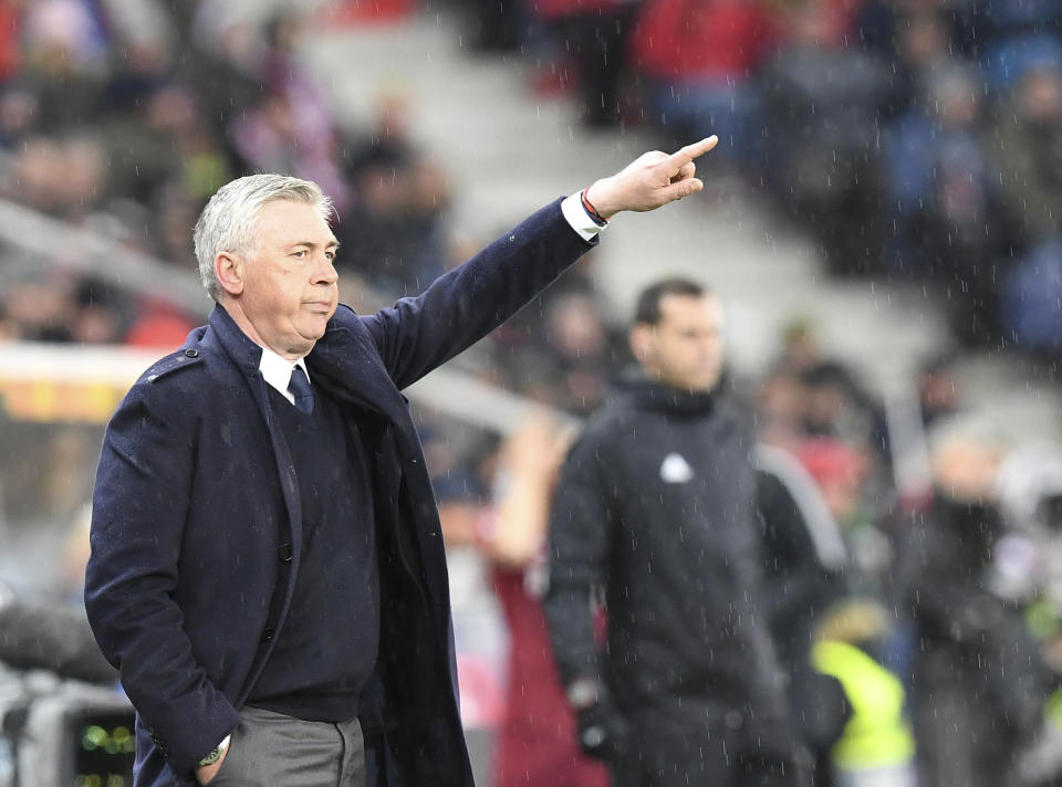 Napoli coach Carlo Ancelotti gives directions to the players during the Europa League round of 16 second leg soccer match between FC Salzburg and Napoli in the Arena stadium in Salzburg, Austria, Thursday, March 14, 2019. (AP Photo/Kerstin Joensson)