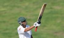 Pakistan v England - First Test - Zayed Cricket Stadium, Abu Dhabi, United Arab Emirates - 13/10/15. Pakistan's Younis Khan raises his bat after becoming Pakistan's leading test run scorer. Action Images via Reuters / Jason O'Brien Livepic