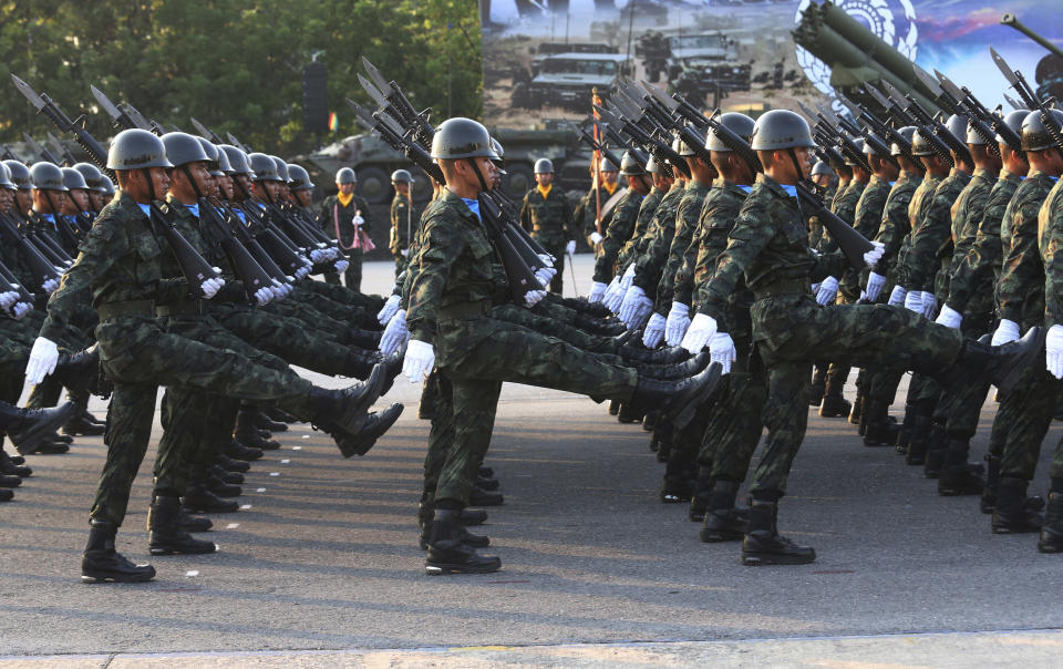 Thai soldiers parade during the Royal Thai Armed Forces Day ceremony at a military base in Bangkok, Thailand, Friday, Jan. 18, 2019. (AP Photo/Sakchai Lalit)