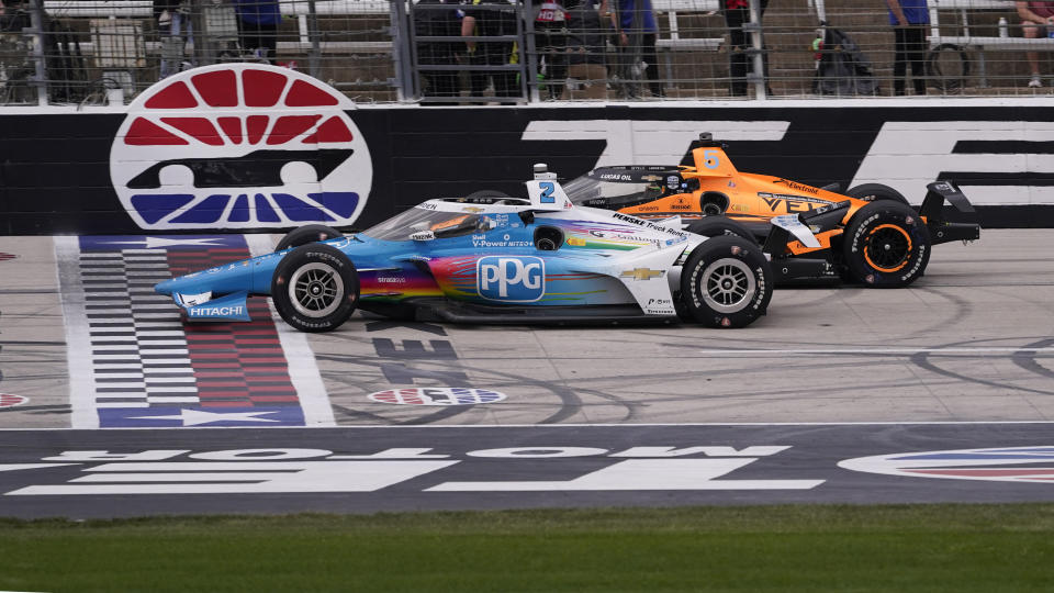 Josef Newgarden (2) pulls ahead of Pato O'Ward (5) of Mexico during the IndyCar auto race at Texas Motor Speedway in Fort Worth, Texas, Sunday, April 2, 2023. Newgarden won the race. (AP Photo/LM Otero)