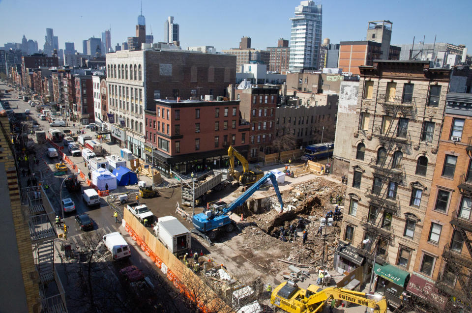 FILE - In this April 2, 2015 file photo, investigators continue work in a debris site remaining from a building explosion and ensuing fire that destroyed three buildings in the East Village neighborhood of New York. Three people were convicted of manslaughter, Friday, Nov. 15, 2019, in the 2015 East Village building explosion that killed two men. (AP Photo/Bebeto Matthews, File)