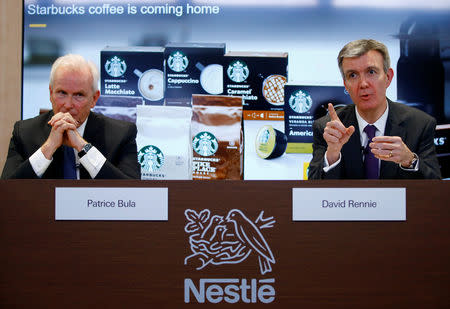 Patrice Bula, Nestle Executive Vice President and Head of Strategic Business Units, Marketing, Sales and Nespresso, sits beside as head of Nestle's coffee unit David Rennie addresses a news conference to announce that Nestle will sell Starbucks-branded coffee at grocery stores in Europe, Asia and Latin America at the company's headquarters in Vevey, Switzerland February 13, 2019. REUTERS/Arnd Wiegmann