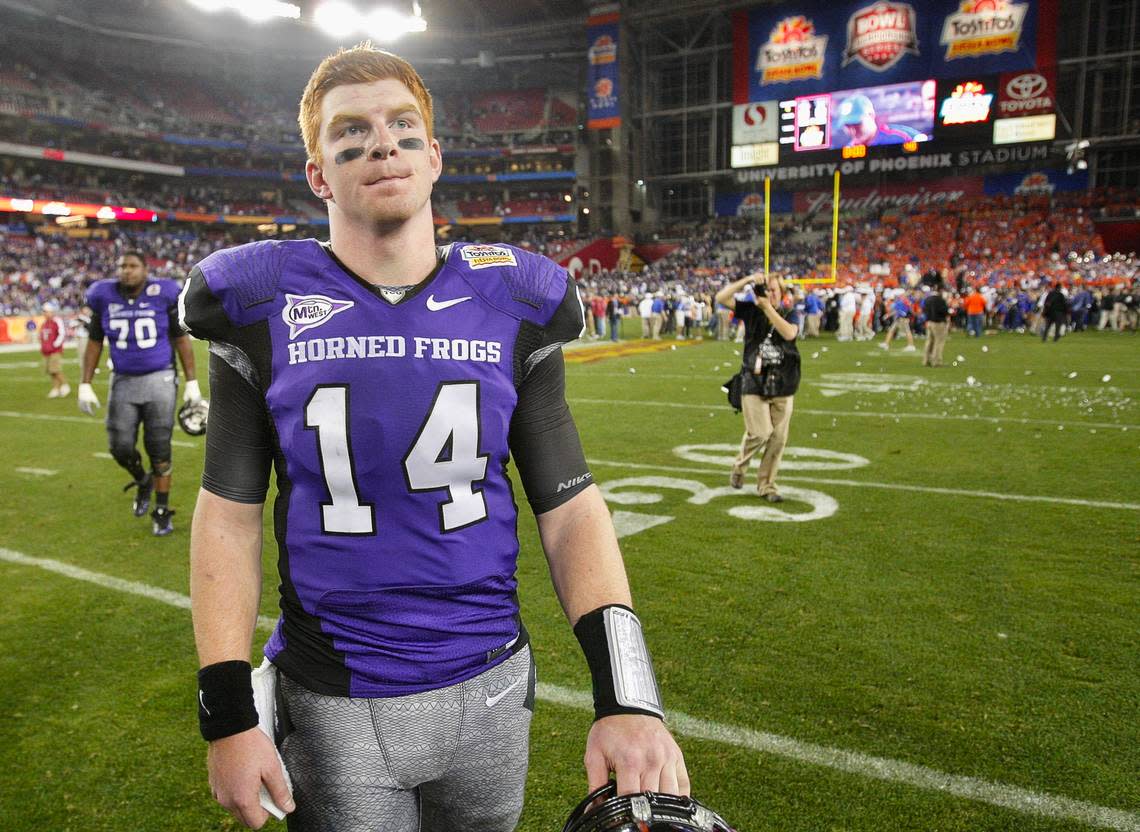 TCU quarterback Andy Dalton (14) leaves the field as Texas Christian University loses to Boise State 17-10 in the Tostitos Fiesta Bowl in Glendale, Arizona, Monday January 4, 2010.