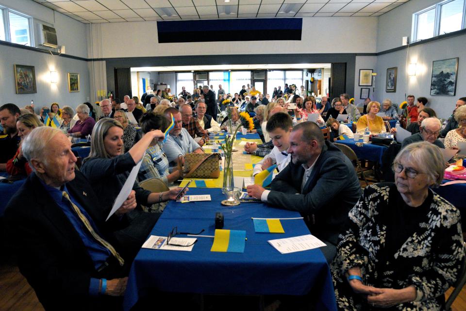 Community members sing “A Little Peace” by Nicole Seibert during a fundraiser for Ukraine at the Lakewood Estonian House on Saturday, May 14, 2022 in Jackson, New Jersey. 