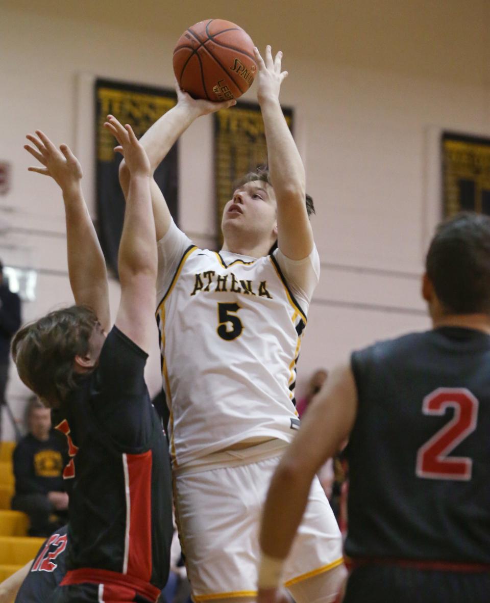 Athena's Connor Osier gets an offensive rebound and puts it back up an in over Hilton's Andrew Lenhard.