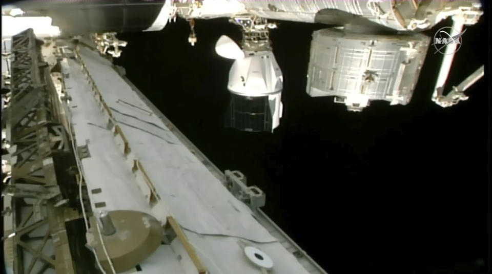 In this image from NASA TV, a SpaceX capsule carrying four astronauts docks at the International Space Station Friday, March 3, 2023. A new crew arrived at the International Space Station on Friday for a six-month mission, after overcoming trouble with one of the capsule’s docking hooks. (NASA TV via AP)
