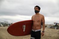 Panpan Wang, 37, attends the Black Girls Surf paddle-out in memory of George Floyd, who died in Minneapolis police custody, in Santa Monica