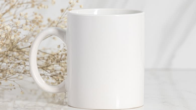 White mug and flowers