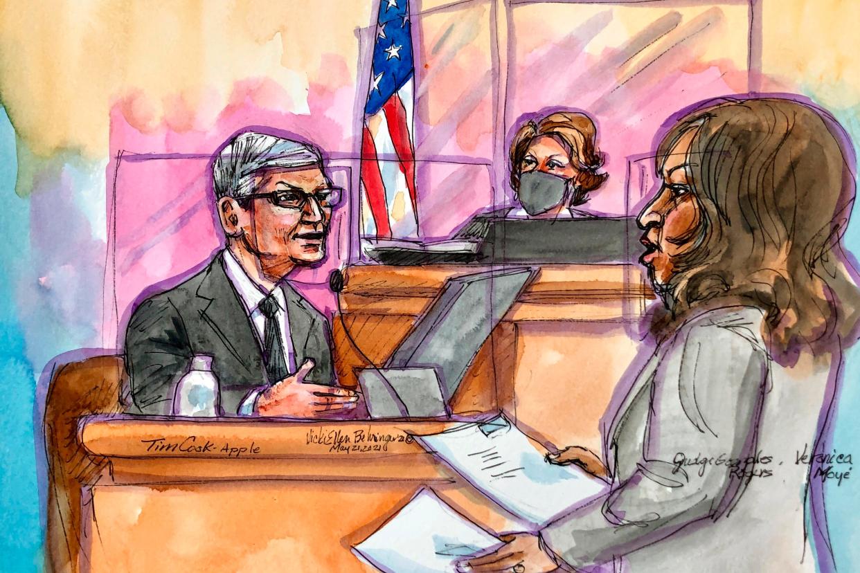 This artist rendering shows Apple CEO Tim Cook on the witness stand being questioned by Apple's attorney Veronica Moyé during a trial in San Ramon, Calif., on Friday, May 21, 2021.