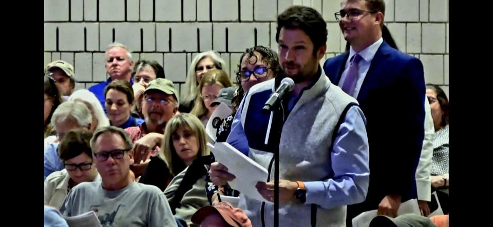 Westport resident Kevin McGoff motions to amend the Westport Community Schools budget on Town Meeting floor. McGoff's amendment was successful, resulting in an additional $152,125 for the district.
