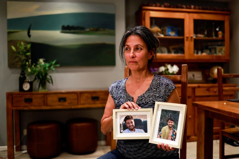 Rachel Goldberg, U.S.-Israeli mother of Hersh Goldberg Polin, which was taken hostage by Hamas militants into the Gaza Strip holds photos of her son, in Jerusalem