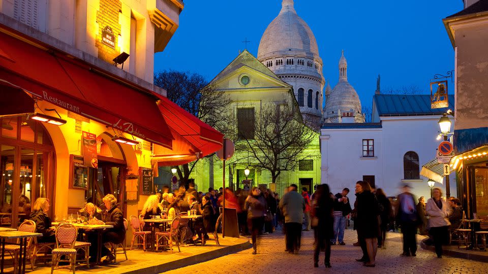 Who couldn't resist a glass of wine in the Montmartre area of Paris? Just make sure you're legal age first. - Sylvain Sonnet/The Image Bank RF/Getty Images