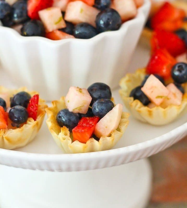 <p>Rachel Cooks</p><p>These mini tarts are beautiful, easy to make, and a refreshing treat for Memorial Day, Independence Day, or ANY day! <strong><a href="http://www.rachelcooks.com/2015/05/19/mini-patriotic-fruit-tarts/" rel="nofollow noopener" target="_blank" data-ylk="slk:Click HERE for recipe;elm:context_link;itc:0;sec:content-canvas" class="link ">Click HERE for recipe</a>. </strong></p>