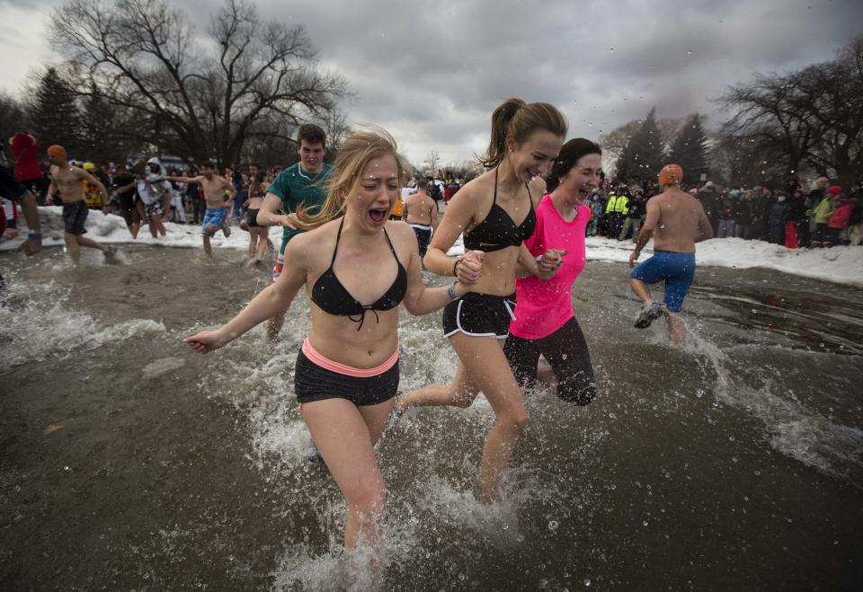 Participants take part in Courage Polar Bear Dip at Coronation Park in Oakville