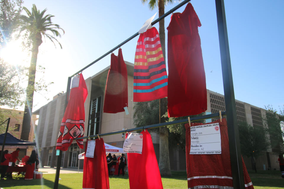 Red skirts are on display at the Arizona State Capitol in Phoenix, Wednesday, May 5, 2021, to raise awareness for missing and murdered Indigenous women and girls. Phoenix Indian Center Executive Director Patricia Hibbeler said the skirts are a huge part of the lives of Native American women and girls. These skirts were created by volunteers at the center in the last few weeks. (AP Photo/Cheyanne Mumphrey)