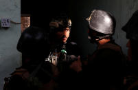 <p>Iraqi special forces soldiers talk to each other as they prepare for attack Islamic State fighters in Mosul, Iraq, Feb. 28, 2017. (Goran Tomasevic/Reuters) </p>