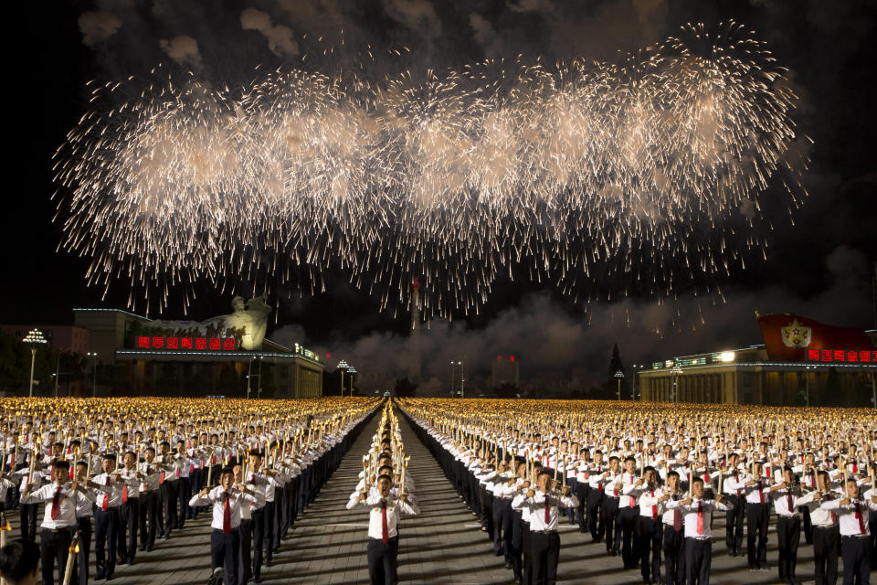 In this Monday, Sept. 10, 2018, file photo, North Korean students take part in a torch light march held in conjunction with the 70th anniversary of North Korea's founding day celebrations in Pyongyang, North Korea. (AP Photo/Ng Han Guan, File)