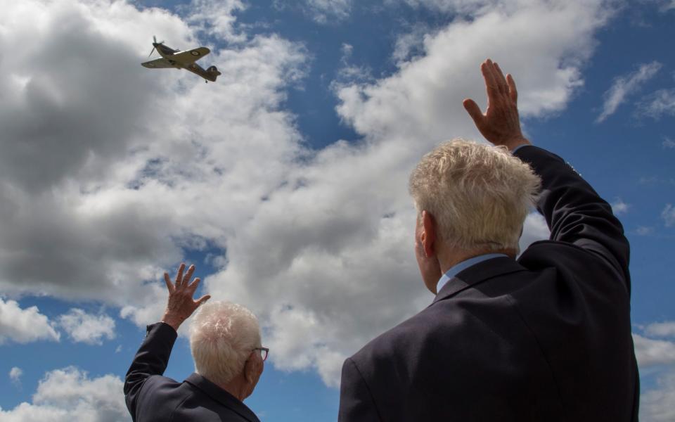 Veterans of Bomber command watch and wave at a WW2 Hurricane as it performs a fly past at the annual Project Propeller gathering of WW2 aircrew veterans - Credit: Tom Pilston