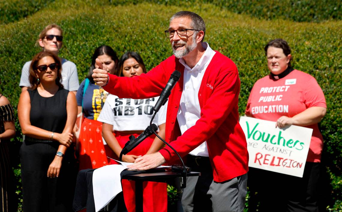 Bryan Proffit, NCAE vice-president, speaks during a press conference against House Bill 10 outside the Legislative Building in Raleigh, N.C. Wednesday, Sept. 11, 2024. The bill, among other things, contains hundreds of millions in private school voucher funding and requires sheriffs to cooperate with U.S. Immigration and Customs Enforcement.