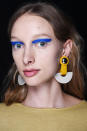 <p>This model shows us how to rock bright blue eye pigment with standout accessories. (Photo: NARS) </p>