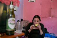 <p>Tamara smokes marijuana from an apple in her room. (Photo: Danielle Villasana) </p>