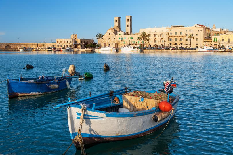 Father Graziano was born in Molfetta, a small town near Bari, one of the main cities of Puglia in Southern Italy - a beautiful blue harbour, with sandy coloured buildings including a cathedral, and boats bobbing on the water