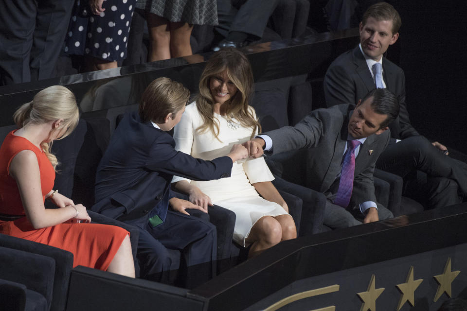 Donald Trump Jr., fist bumps his younger brother Barron, 10, in the Quicken Loans Arena before their father, Donald Trump, the Republican nominee for president, spoke on final night of the Republican National Convention