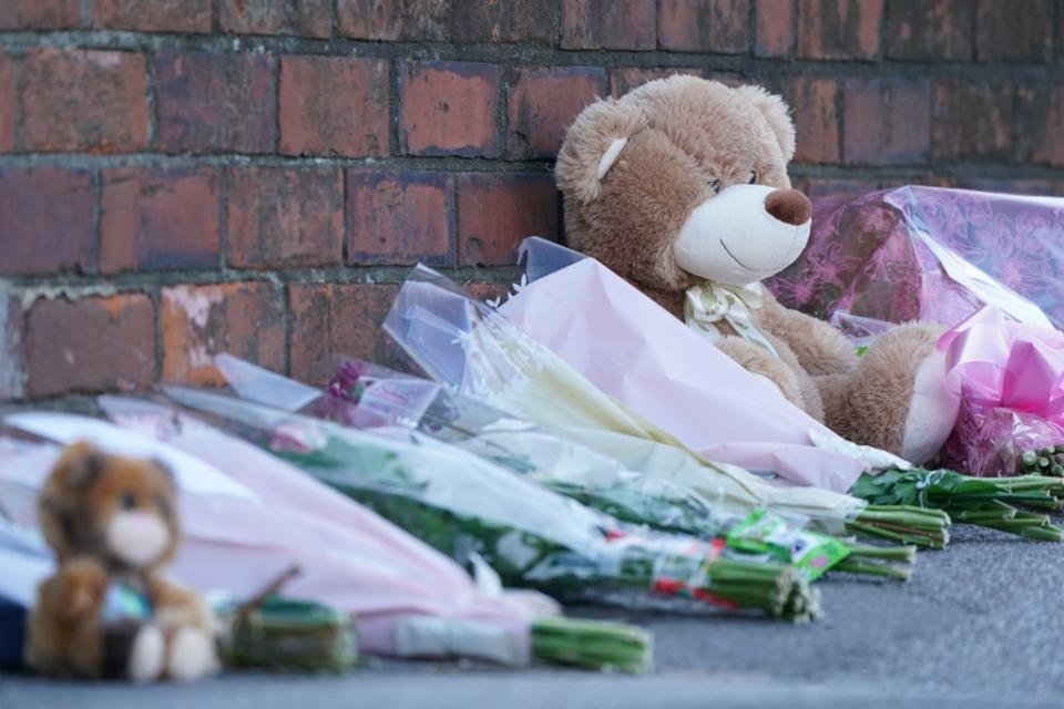 Floral tributes and teddy bears left at the scene in High Holme Road, Louth (Joe Giddens/PA) (PA Wire)