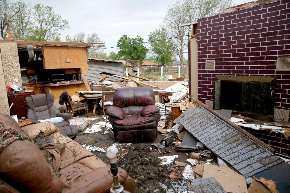 Jeff Totten's living room is pictured at his home,  Thursday, April, 20, 2023, in Shawnee, Okla., after tornado moved through the area Wednesday night in Shawnee, Okla.