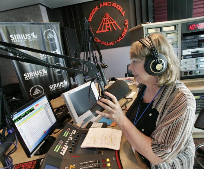 Sirius Satellite Radio DJ Dusty Street begans her first live broadcast from the Rock and Roll Hall of Fame and Museum in Cleveland, Ohio on Saturday, July 2, 2005. Sirius Sattelite Radio launched its live delivery of the station Sirius Gold early classic rock from a studio inside the Rock Hall this weekend. (AP Photo/Amy Sancetta)