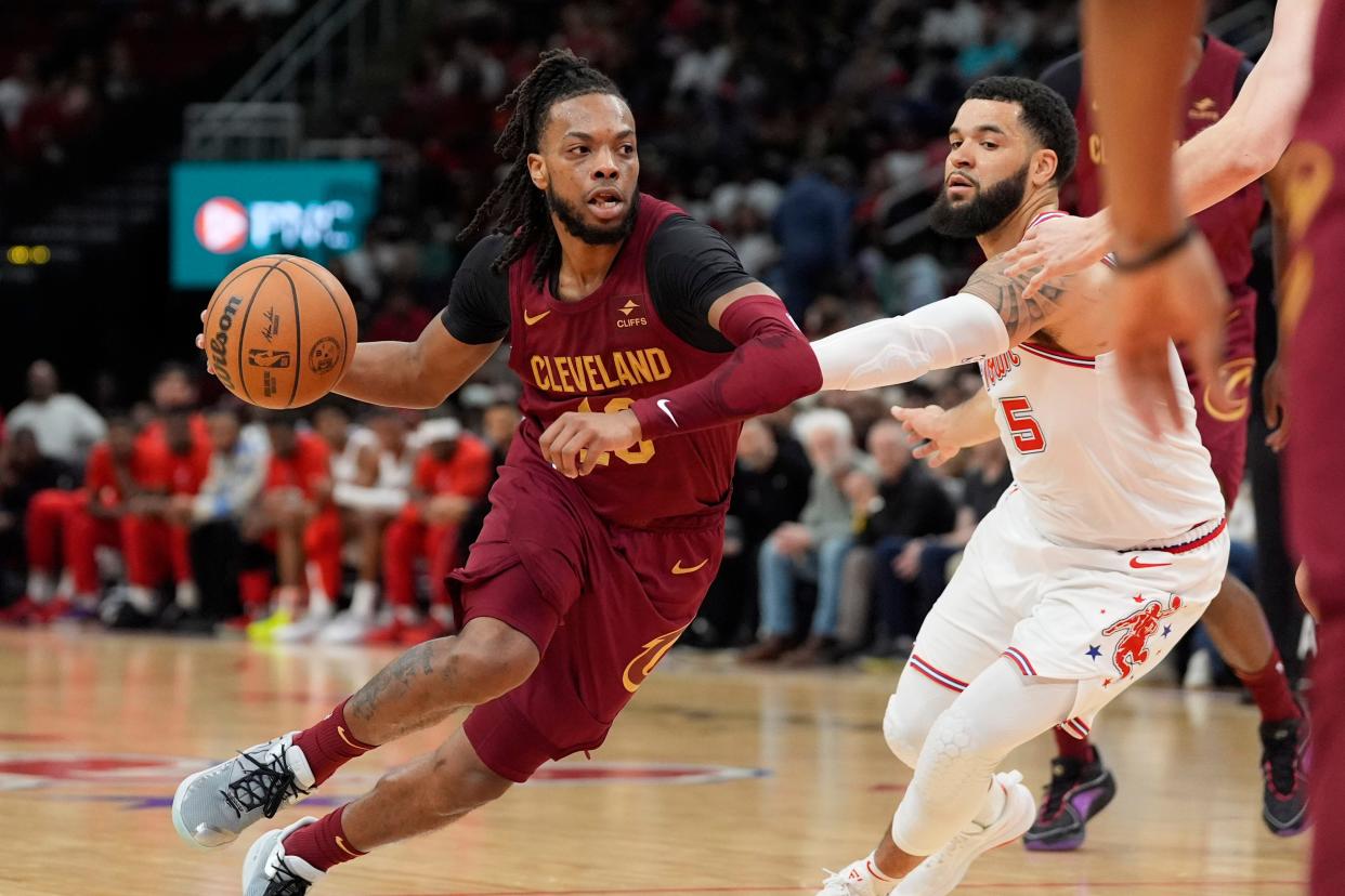 Cleveland Cavaliers' Darius Garland (10) drives toward the basket as Houston Rockets' Fred VanVleet (5) defends Saturday in Houston.