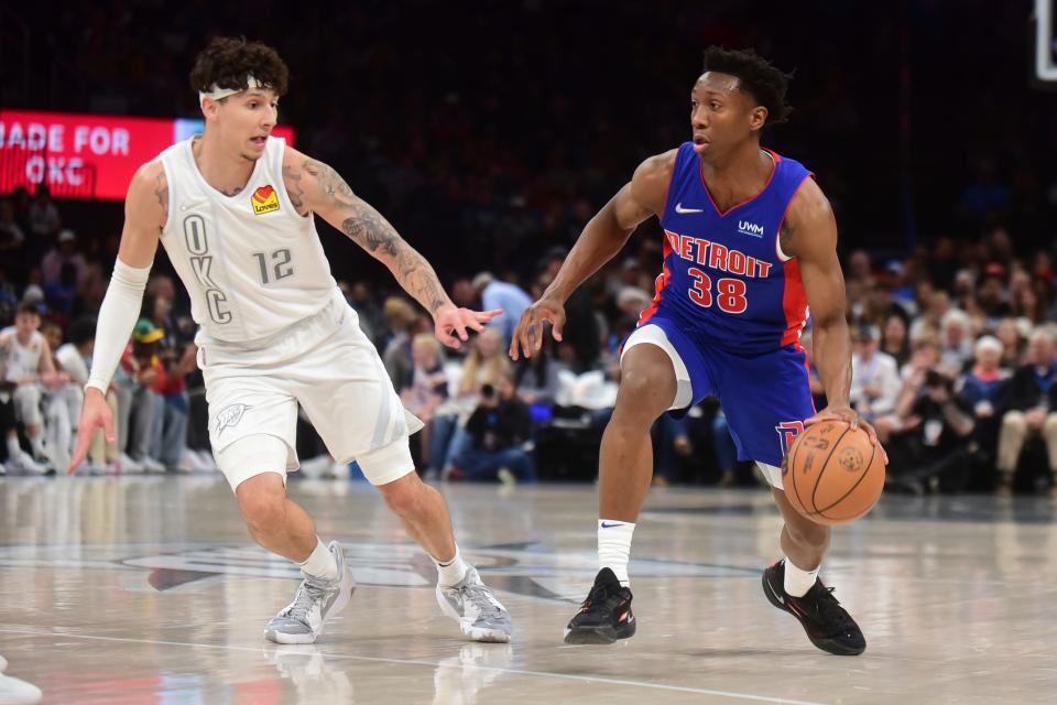 Detroit Pistons guard Saben Lee (38) looks for an opening past Oklahoma City Thunder forward Lindy Waters III (12) in the first half at Paycom Center in Oklahoma City on Friday, April 1, 2022.