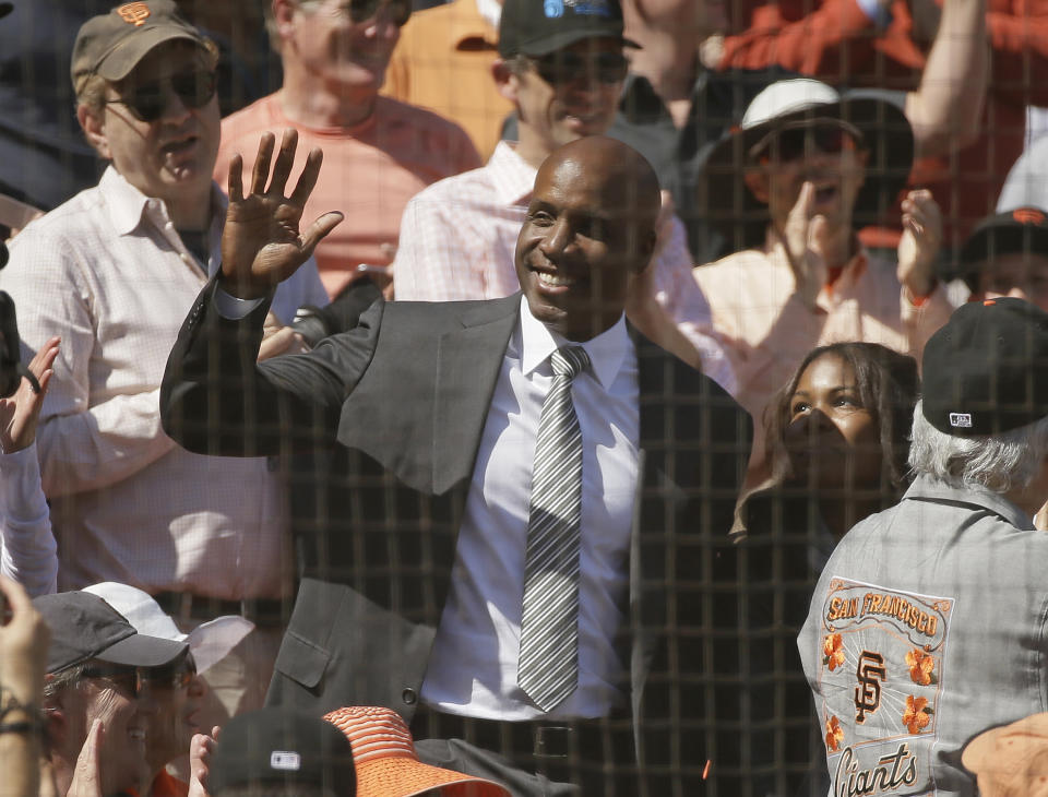 Home run king Barry Bonds waves while being introduced at AT&T Park in the fifth inning of a baseball game between the San Francisco Giants and the Arizona Diamondbacks on Monday, April 10, 2017, in San Francisco. (AP Photo/Eric Risberg)